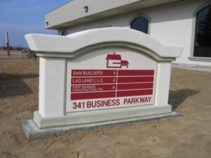 Sign displaying business names and address