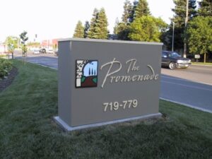 Sign for The Promenade with address details