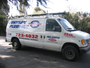 Johnson Plumbing service van parked outdoors