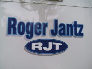 Logo of Roger Jantz with RJT initials.