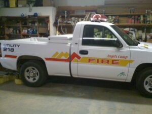 White utility truck marked for fire service