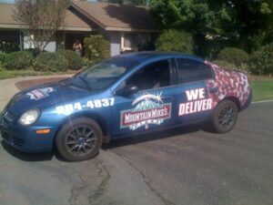 Mountain Mike's delivery car parked on the street.