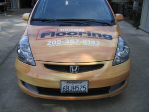 Honda car with TriCounty Flooring advertisement