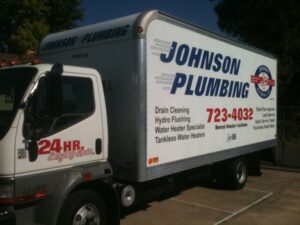 Johnson Plumbing service truck with contact details